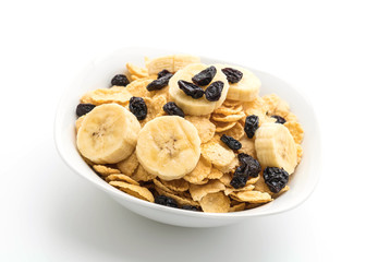 cereal with banana, raisin and milk for breakfast