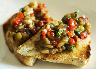 Selection of tasty bruschetta or canapes on taosted baguette