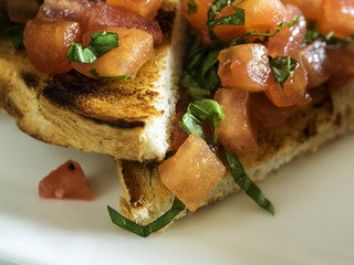 Selection of tasty bruschetta or canapes on taosted baguette