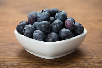 Heap Of Fresh Blueberries In White Bowl