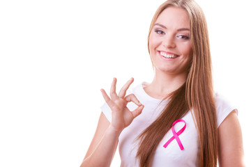 woman pink cancer ribbon on chest making ok sign