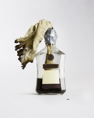 Molotov cocktail. Incendiary mixture in a bottle of cognac on a white background.