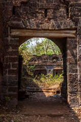 Arch at ancient fortress wall. Redi fort (Yashwantgad Fort). India, Maharashtra