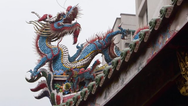 Chinese dragon on top of Longshan Temple, one of the largest and oldest Buddhist temples located in Taipei, Taiwan. Many celebrations are held in Lungshan.