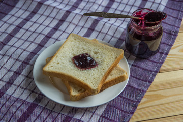 Breakfast: blueberrу jam, toast and orange juice