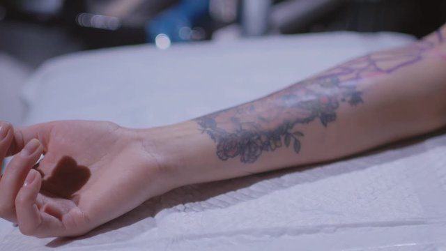 Tattoo artist make tattoo at the studio,close up