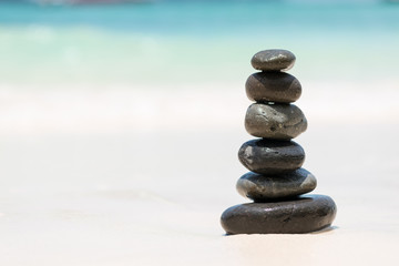 Fototapeta na wymiar Zen Balancing Pebbles on Beach