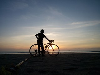 Naklejka na ściany i meble Cycling to a seaside in the Gulf of Thailand.