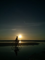 Fototapeta na wymiar Cycling to a seaside in the Gulf of Thailand.