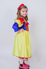 Happy child little girl in Snow White Princess costume