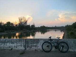 The waterfront view is the sun setting.