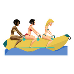 Three young women ride a banana. Girls in the summer on the beac