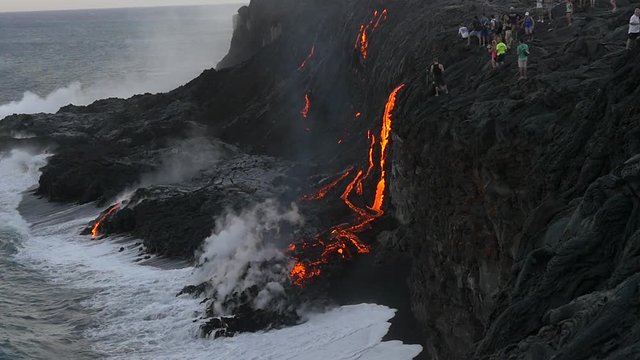 Slow Motion Volcanic Eruption Lava flowing into the water Hawaii