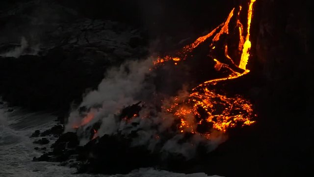 Slow Motion Volcanic Eruption Lava flowing into the water Hawaii