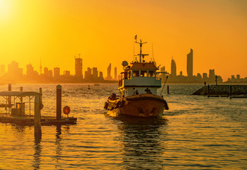 fishing boat during sunset in kuwait