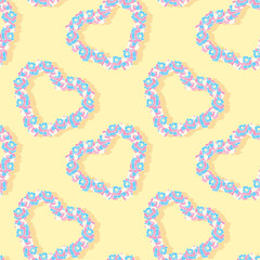 Seamless pattern with colorful floral hearts on soft yellow background