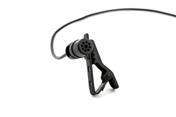 close up of lavalier or clip microphone on white background