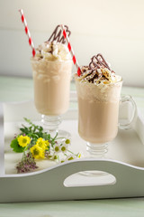 Closeup of iced coffee with whipped cream and chocolate