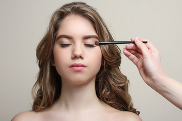 Fototapeta premium Make-up artist does make-up model