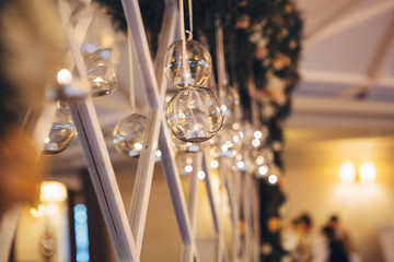 Crystal balls hang from the garland on mirror
