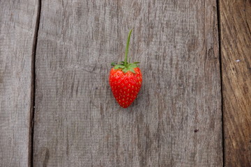 Fresh strawberry on wooden background. 