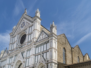Detail of the facade of the famous Basilica di Santa Croce in the historic center of Florence, Italy, on a sunny day and blue skies