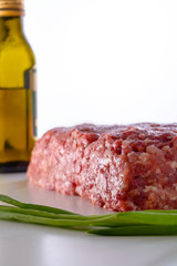 Raw minced meat with green onion and olive oil