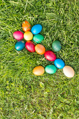 Fototapeta na wymiar colored Easter eggs on the grass