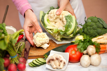 Woman holding part of cauliflower