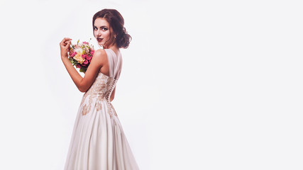 Brunet bride portrait in pink studio