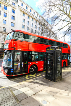 London bus near a wifi phone booth