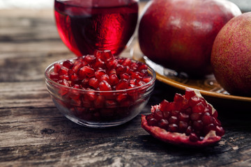 Tasty pomegranate seeds in glass bowl
