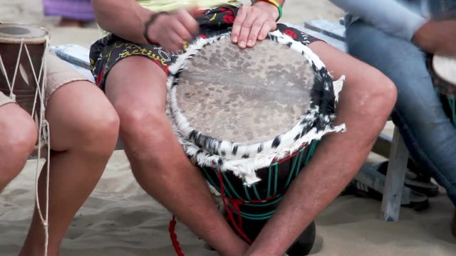 Unidentified man playing on drum 