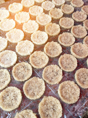 Cooking Fried rice candies with sun light, Pattern of Thai Crispy Rice Cracker "Khaotan", snack from native northern Thailand, Thai dessert of rice cracker.