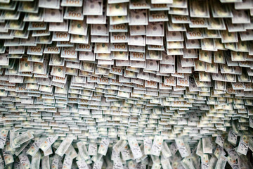 Dollars and Euros hang from the ceiling