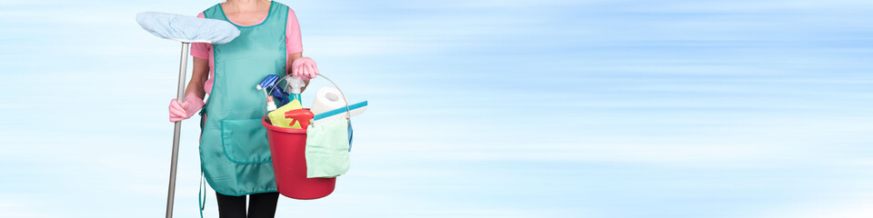 Maid holding a bucket with cleaning equipment