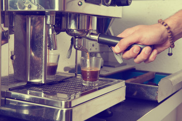 man using espresso machine with portafilter