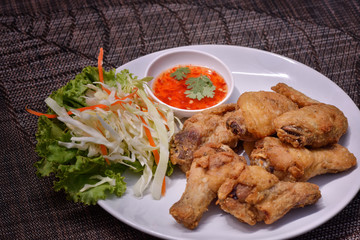 Fresh fried chicken on a white plate 