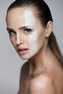 Cosmetics. Sexy Woman With Cream Mask Across Face. Skin Care