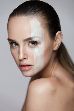 Cosmetics. Sexy Woman With Cream Mask Across Face. Skin Care