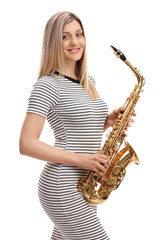 Young woman in a dress with a saxophone
