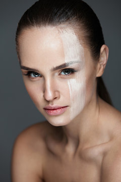 Facial Makeup. Sexy Woman With Cream Mask On Face Skin