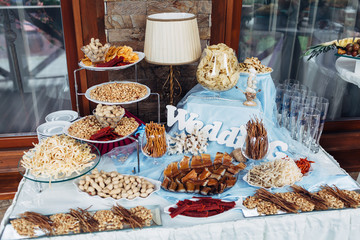 The salty nuts and fishes standing on the buffet table