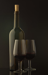 877437 Bottle of wine and vine glass