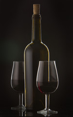 877442 Bottle of wine and vine glass