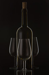 877444 Bottle of wine and vine glass