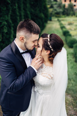 The lovely couple in love embracing in the park