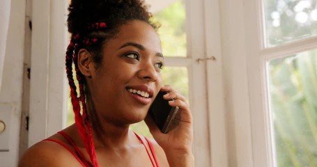 Black girl speaking with smartphone at home, young african american woman relaxing with mobile telephone. Happy hispanic girl talking to friend on the phone
- Powered by Adobe