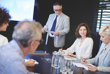 Businessman guiding in conference room