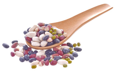 grains mix beans in wood spoon on a white background